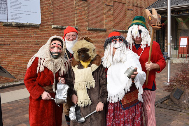 Julebukking costumes have been a decades-long, annual tradition at the Norwegian Christmas celebration on the first weekend of December at the Vesterheim Museum in Decorah, Iowa. At top right, note the traditional goat head on a stick.Photo courtesy of Vesterheim Museum