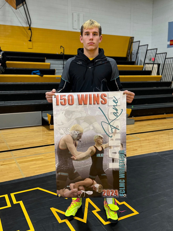 FCLMC wrestler Kane Larson surpassed 150 career wins at the PEM triangular. Ranked #2 at 172 pounds in Class A, the junior is a state title contender and potentially could surpass 200 wins in his career. Photo by Chris Mensink