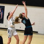 Fillmore Central Falcons' Haley O'Connor jumps for the ball against Schaffer Academy