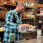 Josh Myhre mixing a drink