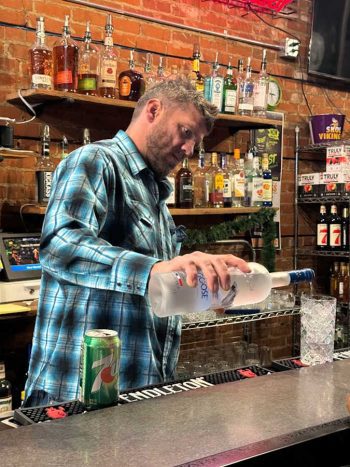 Josh Myhre mixing a drink