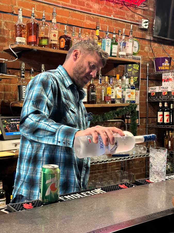 Josh Myhre mixing a drink