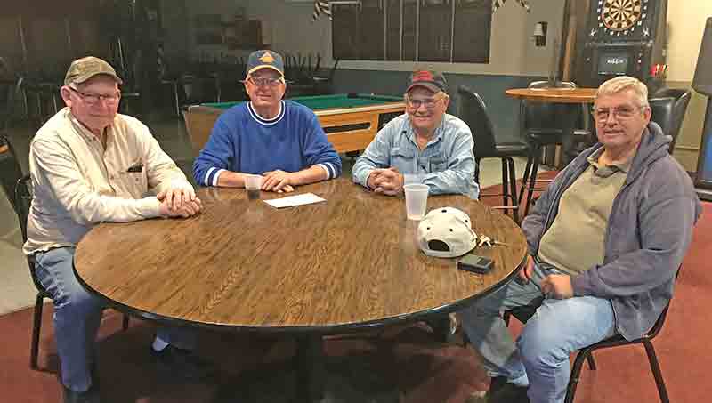 Veterans Home Leaders sit at a table