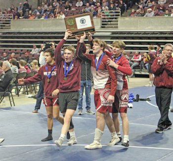 Chatfield Seniors Hold up their trophy.