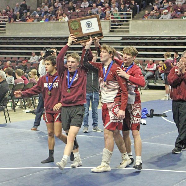 Chatfield Seniors Hold up their trophy.