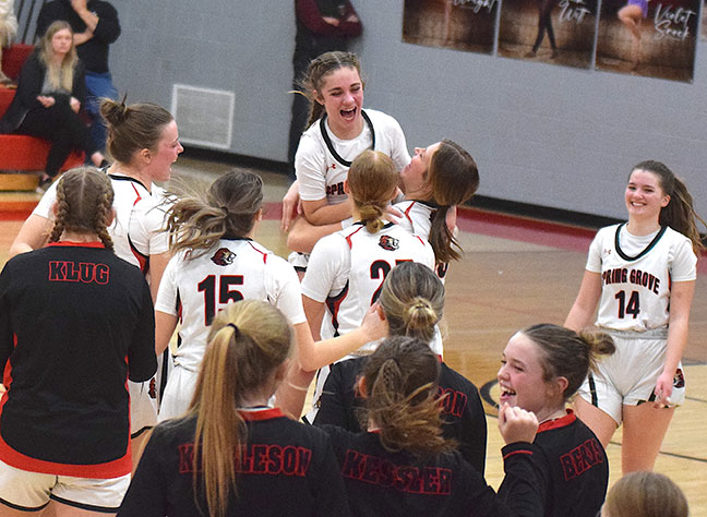 Siri Konkel, Brinley Middendorf and Spring Grove team celebrate