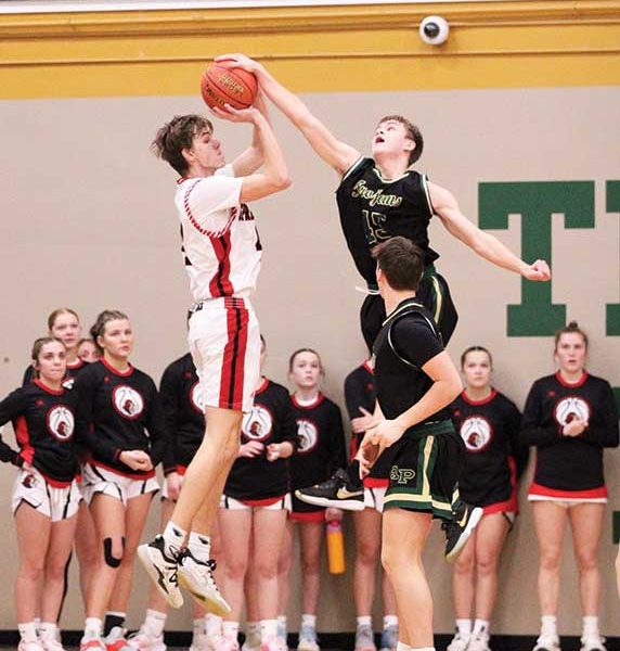 Carson Johnson fouls Ben Udstuen