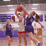 Gracie Foster defensive against Avery Kingsley in Girls Basketball