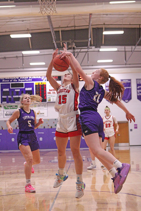 Gracie Foster defensive against Avery Kingsley in Girls Basketball