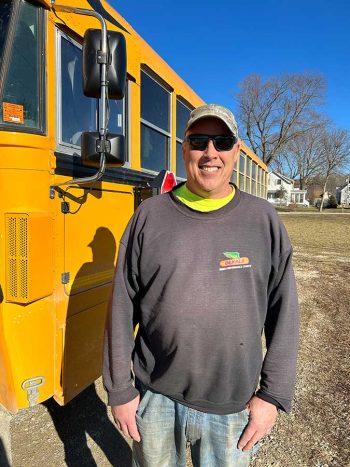 Ross Kramer in front of his bus