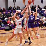 Grand Meadow's Lexy Foster and Kendall Jack jump for a rebound with Lanesboro's Hailey Erickson and Bailey Erwin.