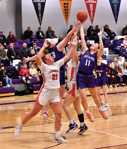 Grand Meadow's Lexy Foster and Kendall Jack jump for a rebound with Lanesboro's Hailey Erickson and Bailey Erwin.