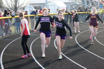 Gracie Foster Hands off to Breely Galle in the 4x200