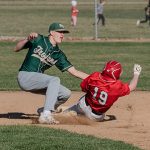 Rushford-Peterson shortstop Carson Johnson applies the tag to Wabasha-Kellogg’s Tyler Hawkins at second base