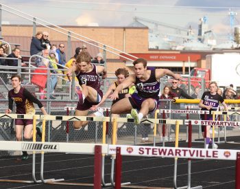 Kegan Patten and Landon Chilman compete in 110 hurdles