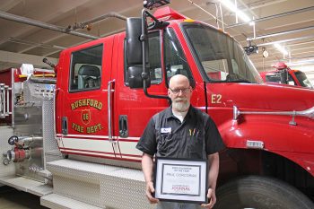 Paul Corcoran in front of Firetruck