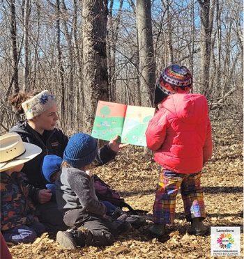 Lanesboro ECFE educator, Alayna Sobieniak, sharing a story at Forest Friends. Photo submitted