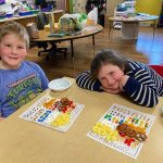 Lee J. and Lydia B. count out 100 snacks. Photo submitted