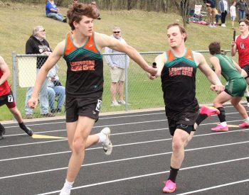 Michael Rein hands off to Greg Kennedy