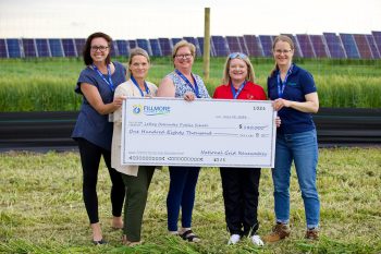 Ladies holding check