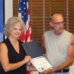 Monica Erickson with award