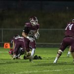 Chatfield’s Ben Carrier runs through a gaping void as lineman Mitchel Hinckley (background) and Jake Stevens (right) dominate blocks while Ethan Eickhoff (left) is also shown. Carrier ran for 208 yards and three scores as the #2 Gophers pounded #8 Cannon Falls 40-8 to clinch their third Southeast-White title in four years. Photo by Leif Erickson
