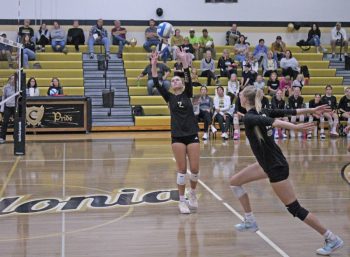 Avery Augedahl sets the ball