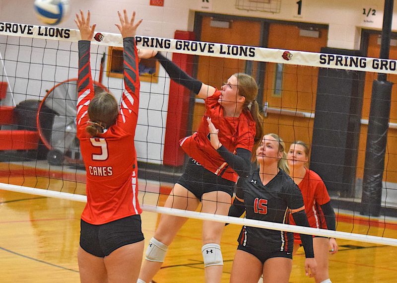 Spring Grove's Emerson Ingvalson sends attack through Houston's blocker, Taylor Stutzka