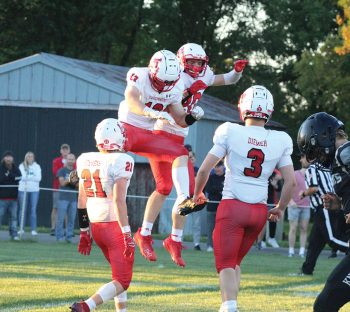Way back and week one, LeRoy-Ostrander/Lyle/Pacelli started celebrating, Landon Meyer and Carter Sweeney whooping it up after a touchdown. Eight weeks later, the Cardinals can celebrate a South-East sub-district shared title with Spring Grove. L-O/L/P knocked off Lanesboro 58-8 in week eight to earn the distinction, and to grab the #1-seed in the Section 1 9-Man play-offs. Photo by Paul Trende