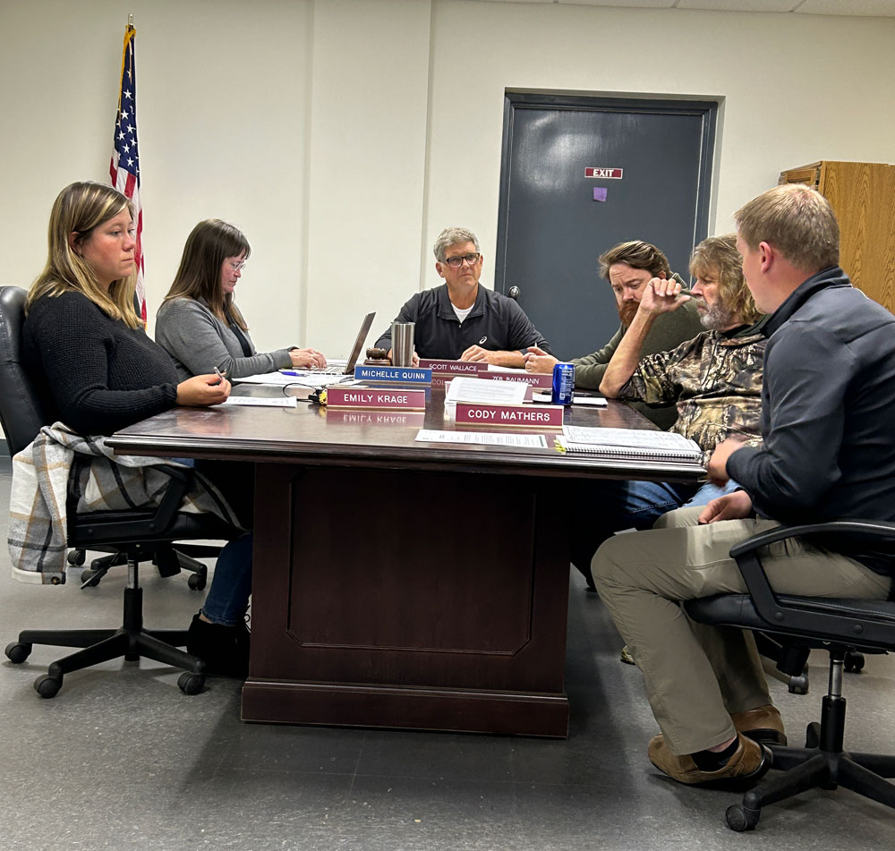 The council listens to Derek Olinger as he updates them on the CSAH 13/Spruce Street project. From left to right: Emily Krage, City Administrator Michelle Quinn, Mayor Scott Wallace, Zen Baumann, Steve Westby and Derek Olinger of Bolton & Menk. Cody Mathers was absent. Photo by Wanda Hanson