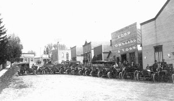 The T Car Club in front of the Onsgard & Foss Ford dealership in Spring Grove (about 1909-1912). Notice the two horse-drawn buggies in the background. Photo submitted