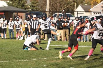 In a 14-14 game in overtime, after the Knight defense held Spring Grove on downs at the one with their possession, senior receiver/defensive back/kicker Caden Reiter got to be the hero, booting the above 17-yard field on 4th down to propel the Knights to a 17-14 win over #6 in 9-Man Spring Grove. Photo by Christine Vreeman