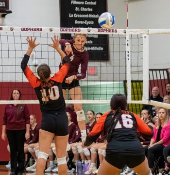 Chatfield’s Jaelyn LaPlante skies for the kill over St. Charles defender Kate Vermilya (#10) in the teams’ Round of 16 contest. The top-ranked #3 Gophers posted an easy sweep to improve to 25-4. Photo by Leif Erickson