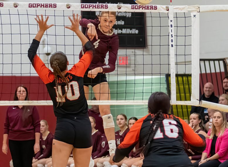 Chatfield’s Jaelyn LaPlante skies for the kill over St. Charles defender Kate Vermilya (#10) in the teams’ Round of 16 contest. The top-ranked #3 Gophers posted an easy sweep to improve to 25-4. Photo by Leif Erickson