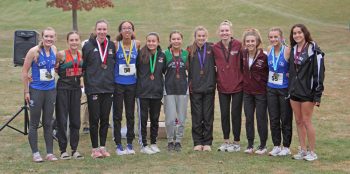 The top 11 girls cross country runners in Section 1A. Included are Lanesboro/Fillmore Central’s Autumn Rakosnik (second from left) and Chatfield’s Lexi Kivimagi (fourth from right). They finished second and eighth overall to earn their second and fourth state qualifications. Photo by Paul Trende