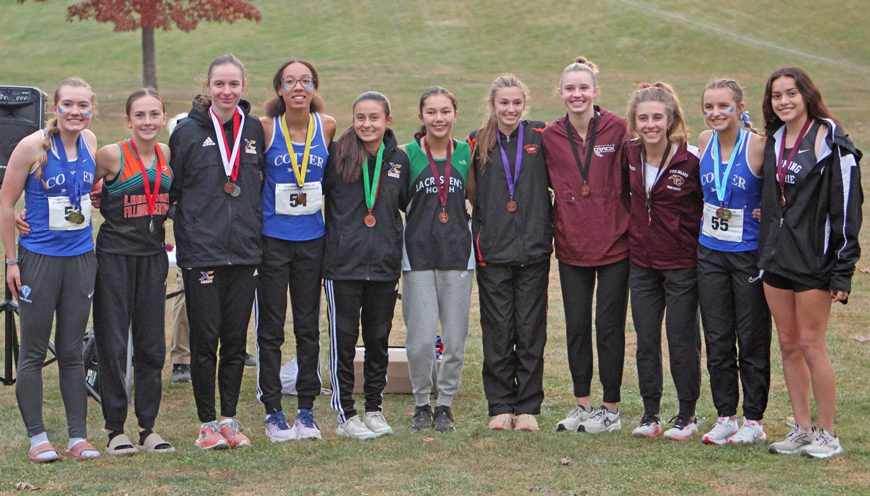 The top 11 girls cross country runners in Section 1A. Included are Lanesboro/Fillmore Central’s Autumn Rakosnik (second from left) and Chatfield’s Lexi Kivimagi (fourth from right). They finished second and eighth overall to earn their second and fourth state qualifications. Photo by Paul Trende