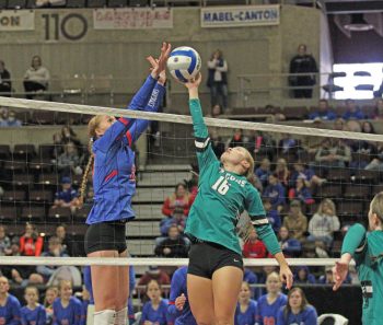 Mabel-Canton’s Kinley Soiney and Fillmore Central’s Aubrey Daniels battle at the net for an errant pass in the 1A championship match. The Falcons pulled the 3-1 shocker to advance to state.