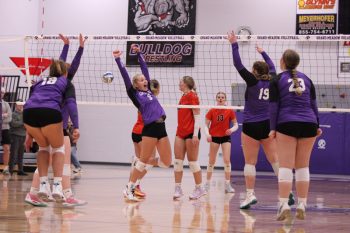 Grand Meadow senior Lauren Queensland is front and center to celebrate after the Superlarks beat Lanesboro 3-1 in a 1A Round of 16 volleyball game. Doing so clinched GM a trip back to Rochester for the section final eight for the first time since 2018. Photo by Paul Trende