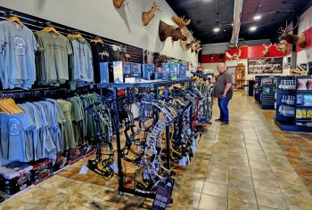 Corey Kobbervis from Anthem Archery runs ideas by a customer for some new gear. Photo by Zech Sindt