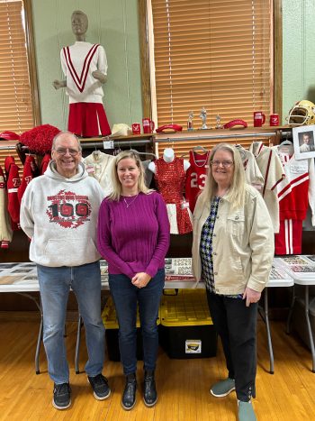 Some of the HAM board members pose by the Houston High School display. From left to right: Treasurer Larry Jerviss, Secretary Michelle Hoskins, and President Shelley Jerviss. Not pictured are Vice President Rick Bartz and curator and historian, Jim Skree. Photo by Wanda Hanson