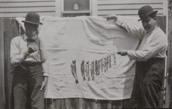 Two fishermen of yesteryear pose with their catch of 11. Photo courtesy courtesy of the Houston County Historical Society