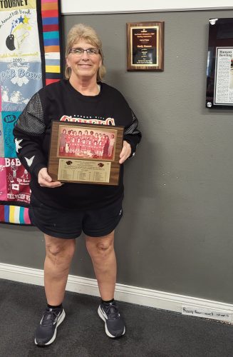 Shelly Hanson shows off her Missouri Sports Hall of Fame plaque. Photo by Hannah Wingert