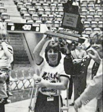 Shelly Hanson holds up a team trophy during her 1985 senior year as a Lady Panther. Photo submitted