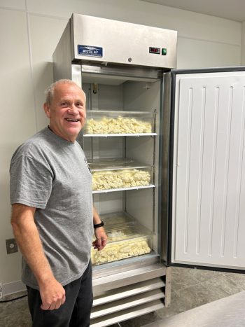 Terry displays the massive amounted of potatoes prepared for the day of lefse making. Photo by Wanda Hanson