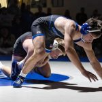 Chatfield’s Alden Pearson has the leg of Kasson-Mantorville’s Broc Vaughn in the combatants 145-pound bout. Pearson’s 5-0 decision win was one of eight victories for the Class A #1 Gophers in their 39-15 win over the Class AA #1-ranked KoMets.