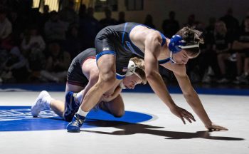 Chatfield’s Alden Pearson has the leg of Kasson-Mantorville’s Broc Vaughn in the combatants 145-pound bout. Pearson’s 5-0 decision win was one of eight victories for the Class A #1 Gophers in their 39-15 win over the Class AA #1-ranked KoMets.