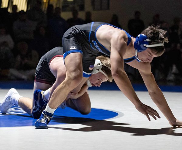 Chatfield’s Alden Pearson has the leg of Kasson-Mantorville’s Broc Vaughn in the combatants 145-pound bout. Pearson’s 5-0 decision win was one of eight victories for the Class A #1 Gophers in their 39-15 win over the Class AA #1-ranked KoMets.