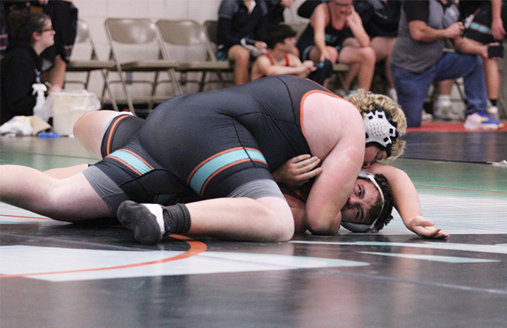 In maybe FCLMC’s best win at their home triangular, Beau Lacey works for a pin on St. Charles’ Tucker Larson. Lacey trailed 7-0 (and was nearly pinned himself) before posting the second period stick.