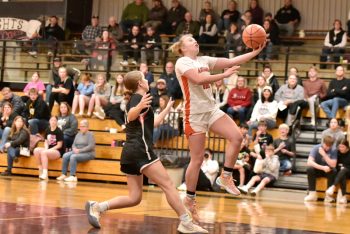 Lanesboro’s Jensyn Storhoff, who scored 20 in the game, swoops to the hoop in the Burros’ 57-49 season-opening win over Alden-Conger/Glenville-Emmons. Photo by Ron Mayer