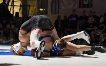 Chatfield’s Kaisen Johnson works to try to turn Kasson-Mantorville’s Noah Cocker at 133-pounds. Johnson posted a 17-1 tech fall win as part of Chatfield’s 35-19 team victory.